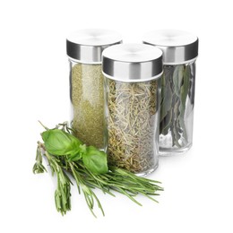 Photo of Many different aromatic spices in jars isolated on white