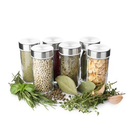 Photo of Many different aromatic spices in jars isolated on white
