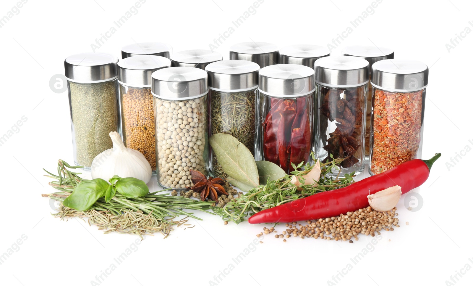 Photo of Many different aromatic spices in jars isolated on white