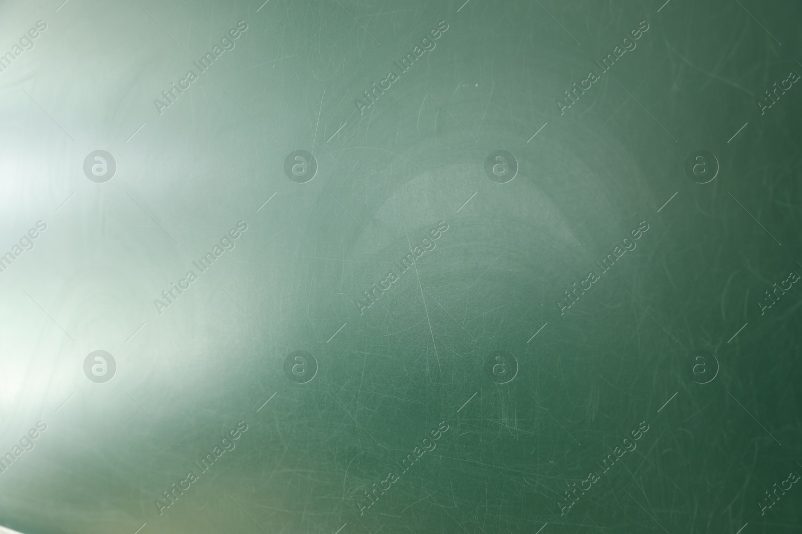 Photo of Blank green chalkboard as background, closeup view