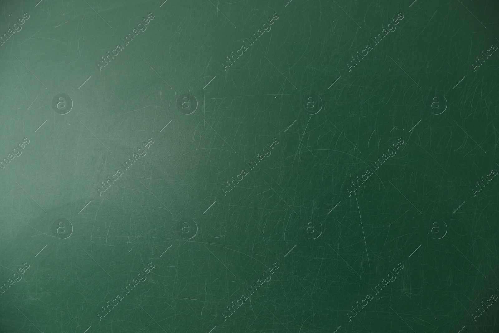 Photo of Blank green chalkboard as background, closeup view