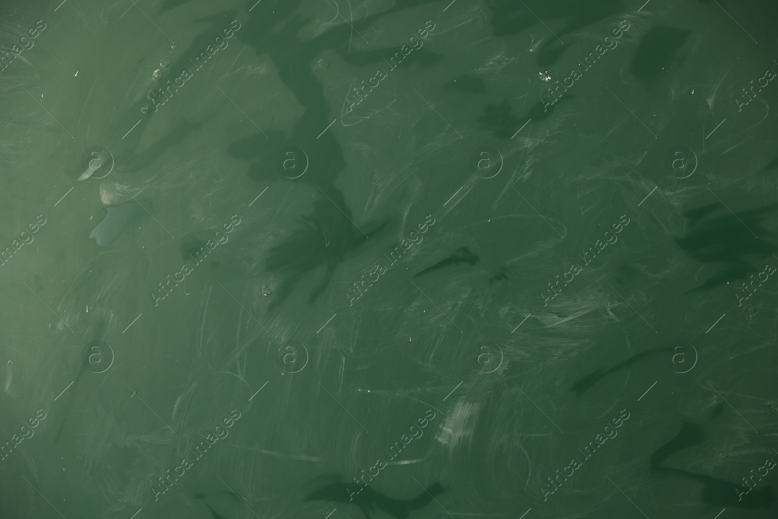 Photo of Blank green chalkboard as background, closeup view