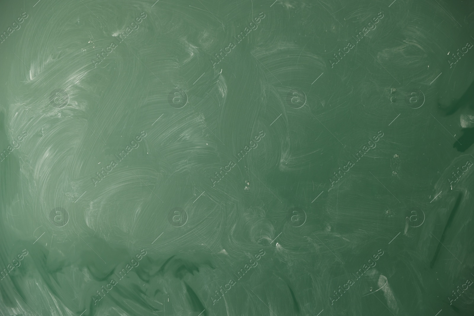 Photo of Blank green chalkboard as background, closeup view