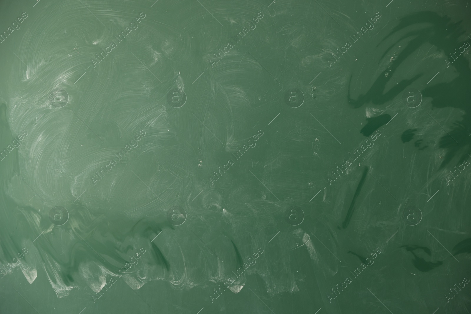 Photo of Blank green chalkboard as background, closeup view