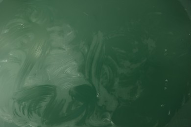 Photo of Blank green chalkboard as background, closeup view