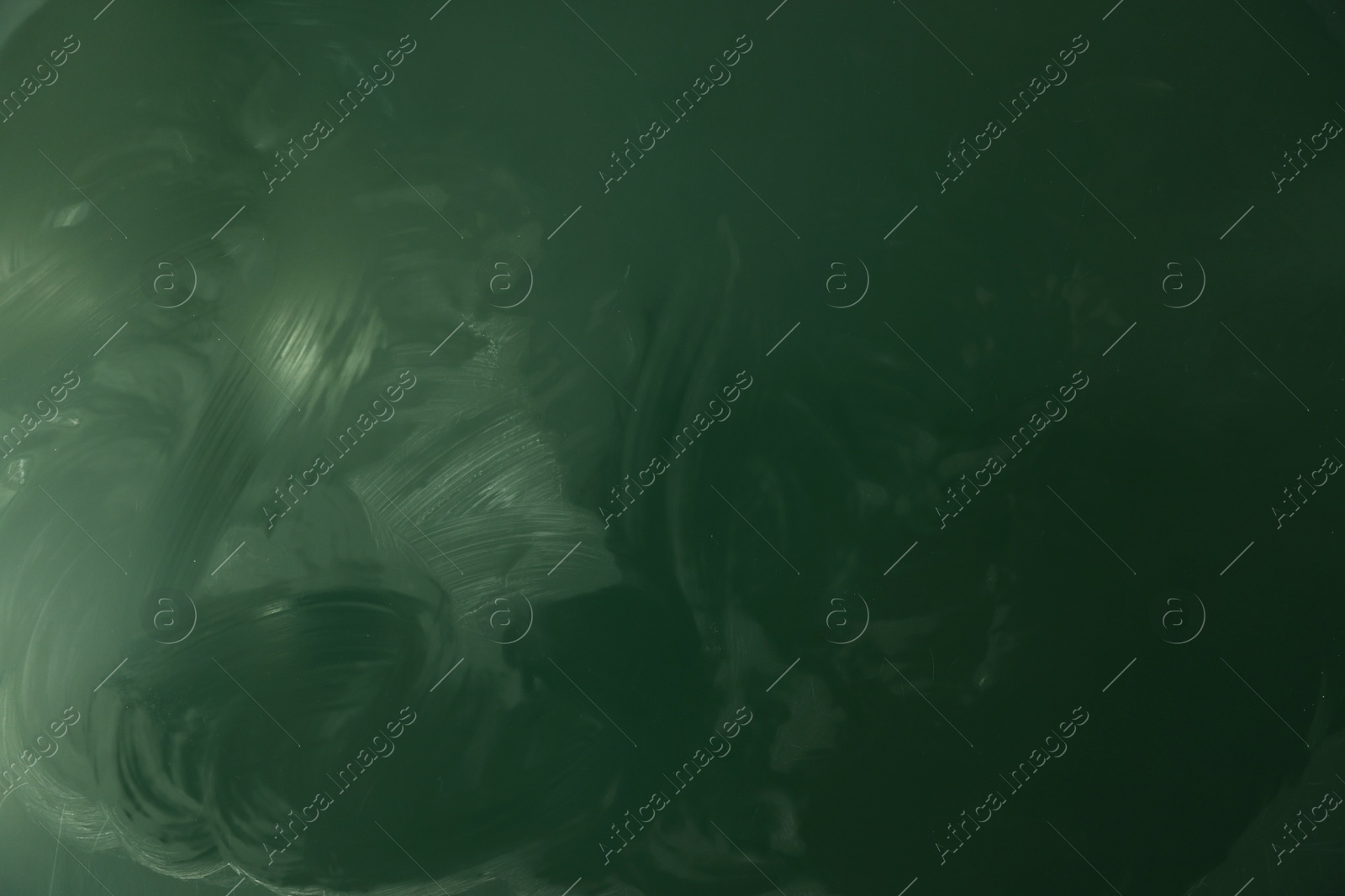 Photo of Blank green chalkboard as background, closeup view