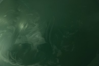 Photo of Blank green chalkboard as background, closeup view