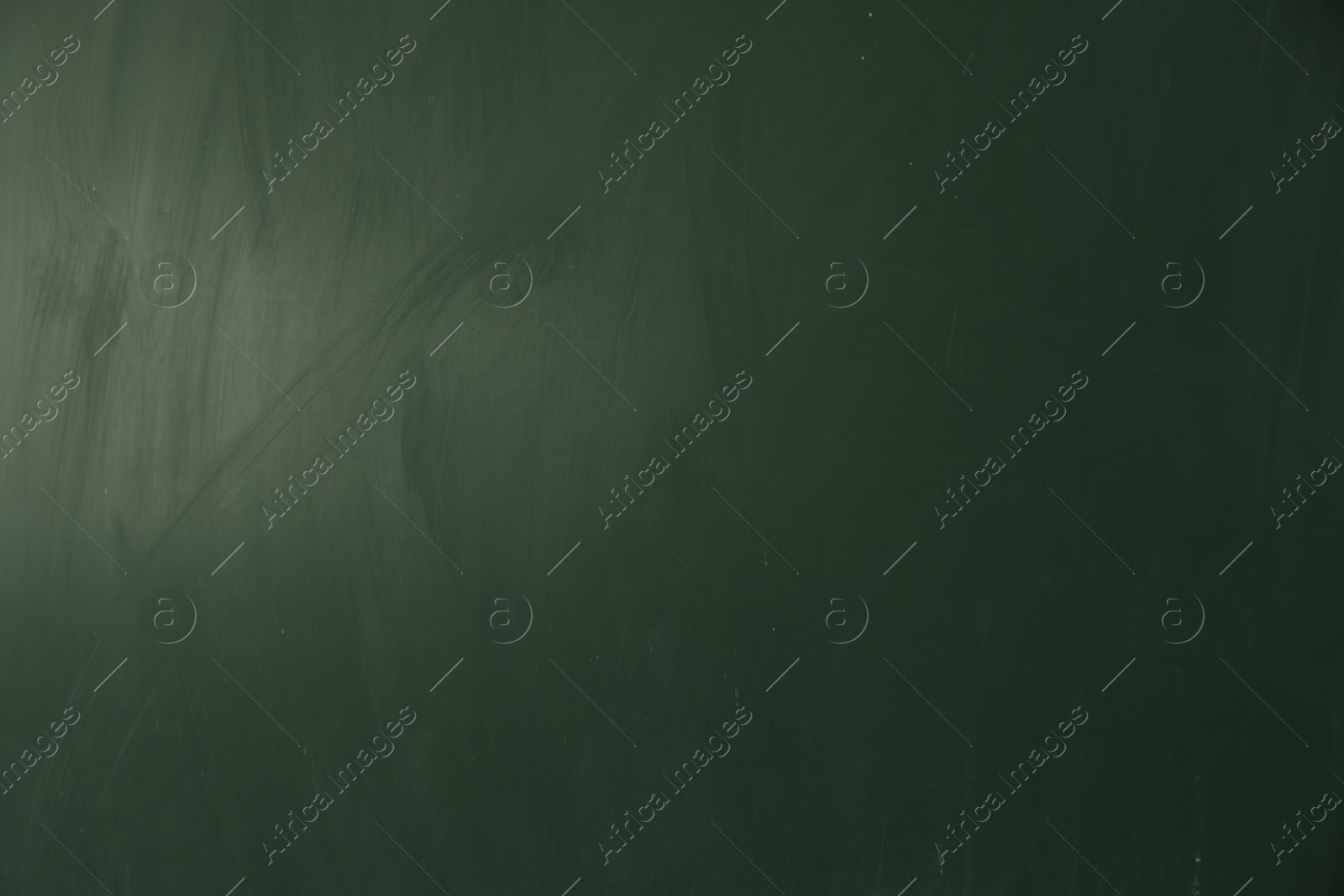 Photo of Blank green chalkboard as background, closeup view