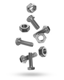 Image of Metal nuts and bolts falling against white background