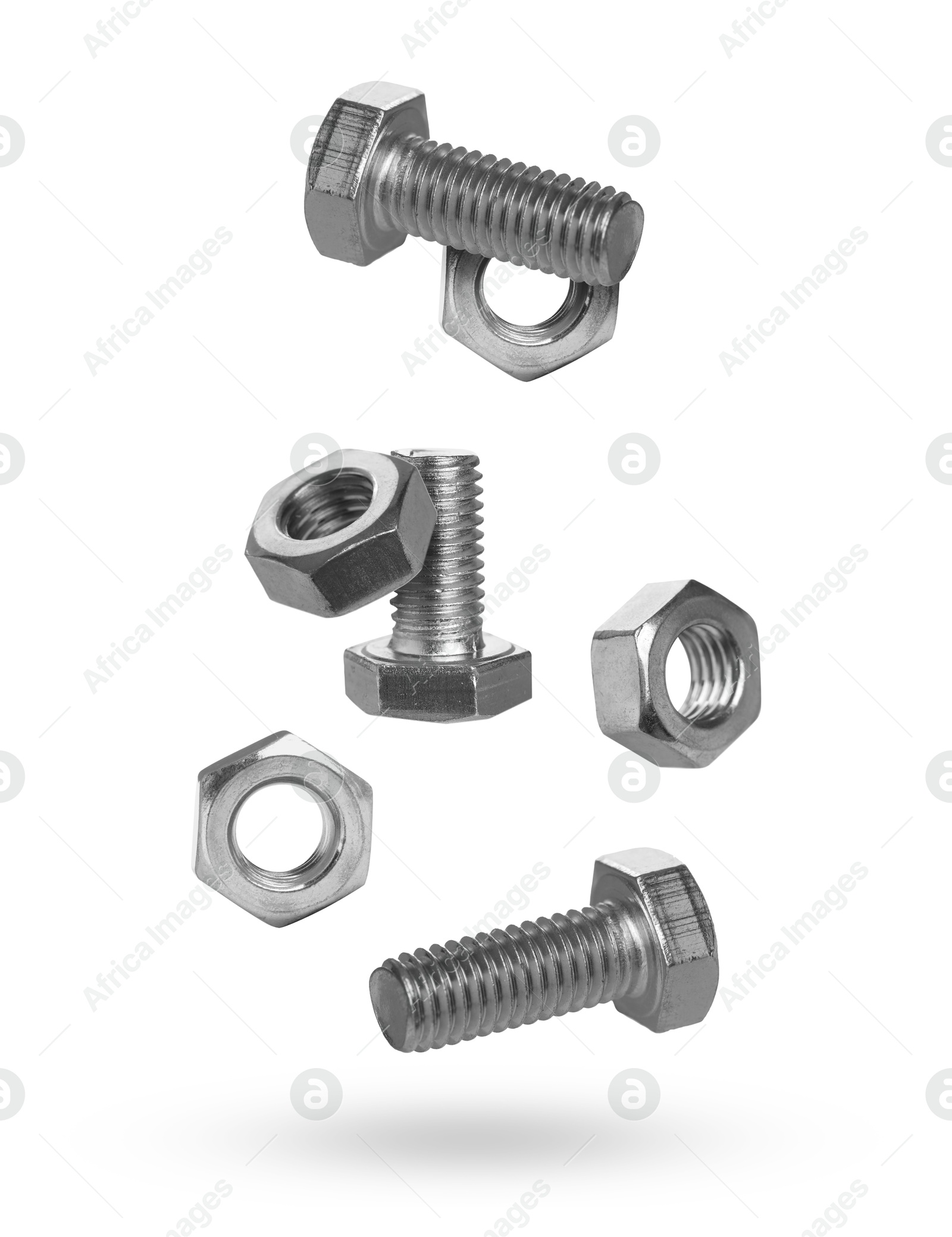 Image of Metal nuts and bolts falling against white background