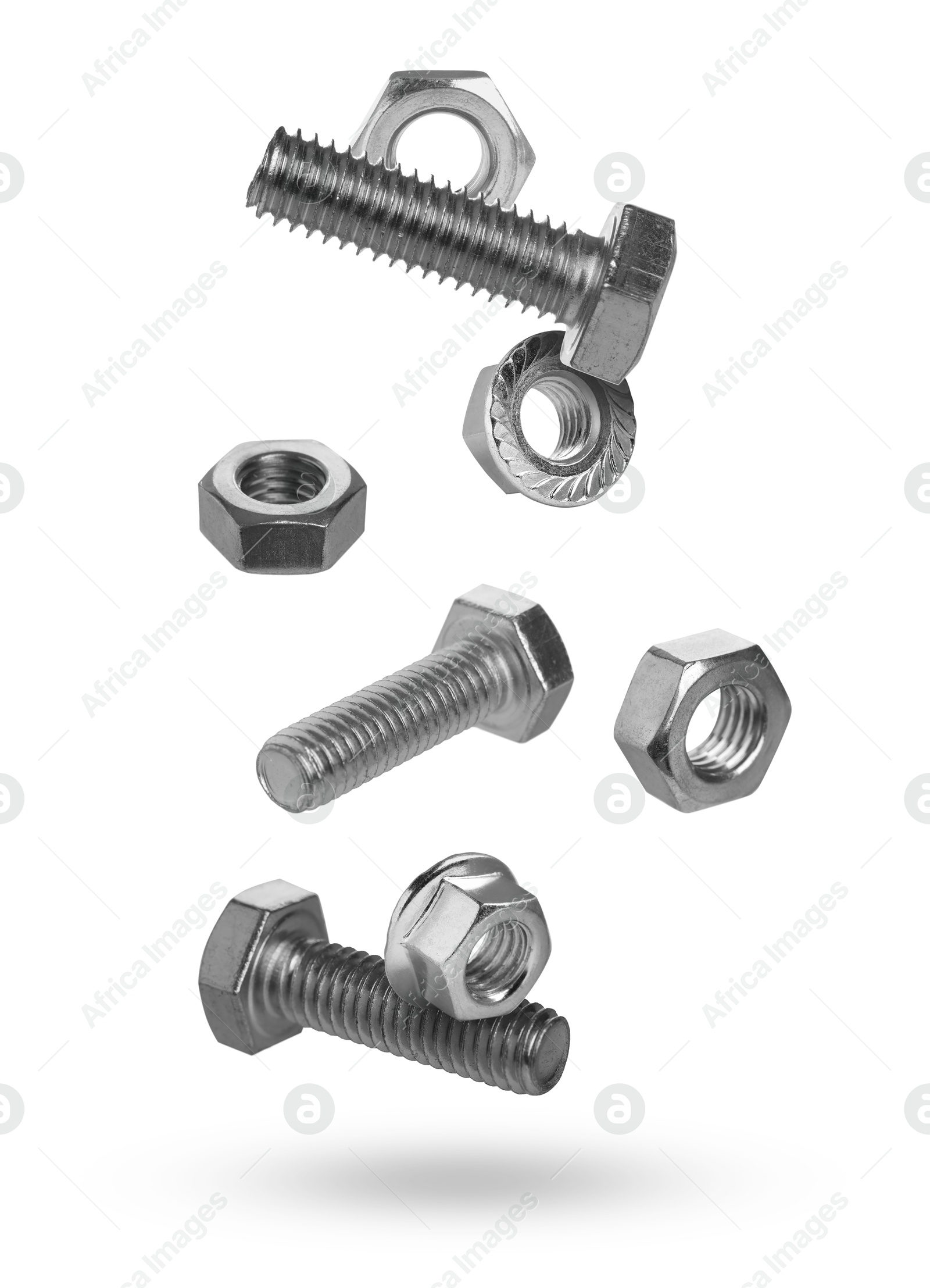 Metal nuts and bolts falling against white background Image of Metal nuts and bolts falling against white background