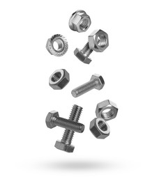 Image of Metal nuts and bolts falling against white background