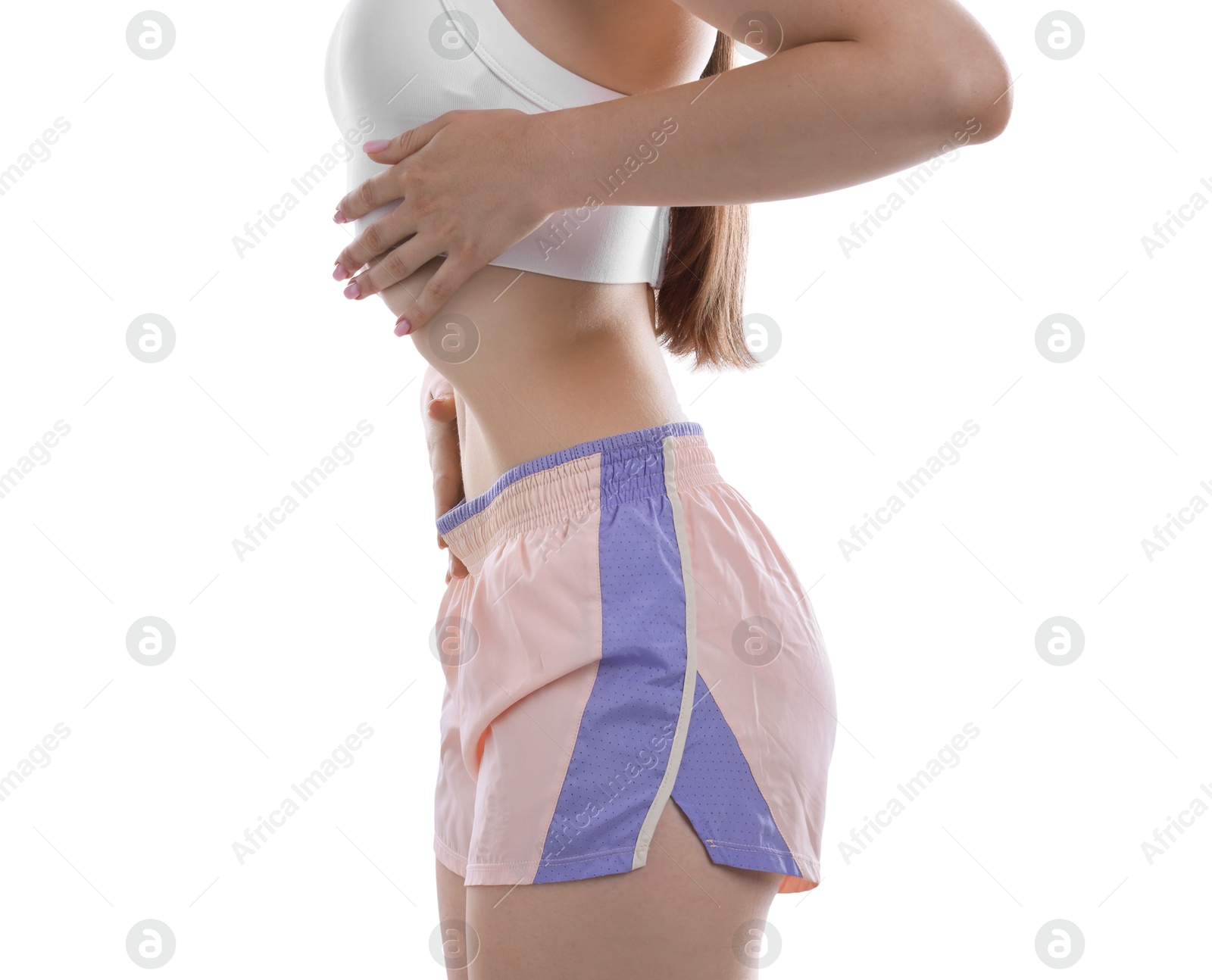 Woman doing abdominal vacuum exercise on white background, closeup Photo of Woman doing abdominal vacuum exercise on white background, closeup