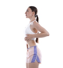 Photo of Woman doing abdominal vacuum exercise on white background