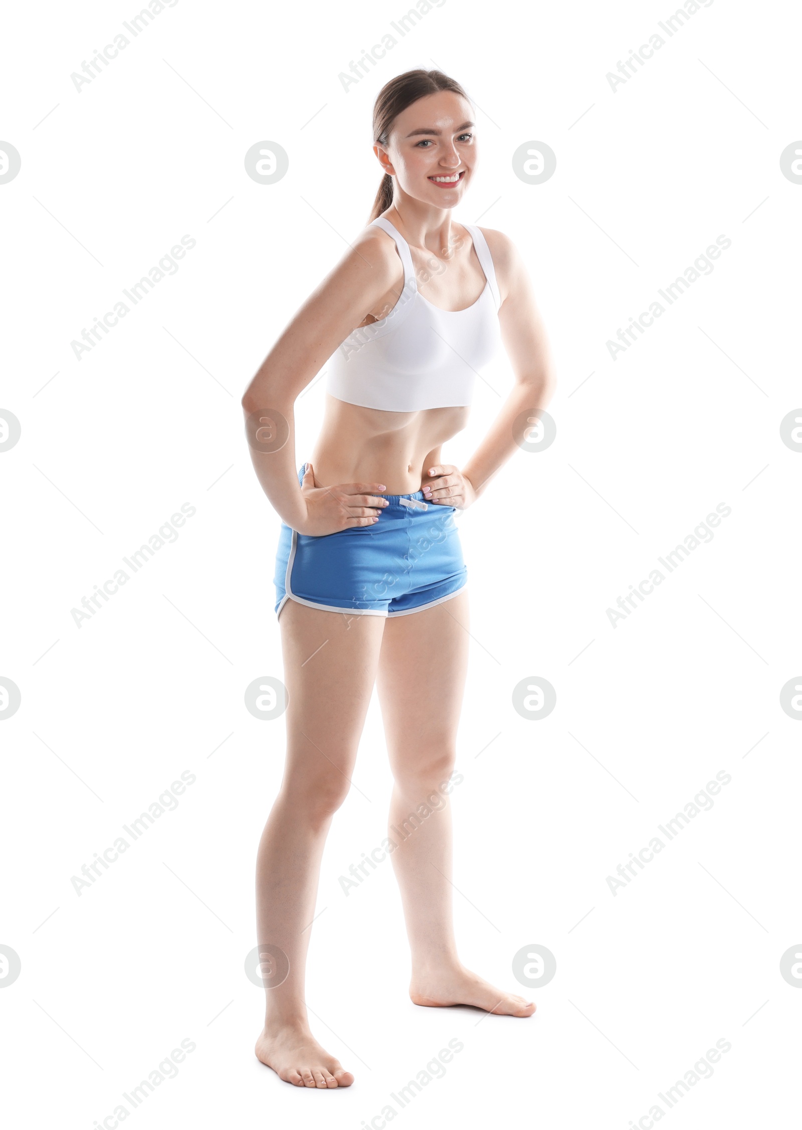 Happy woman doing abdominal vacuum exercise on white background Photo of Happy woman doing abdominal vacuum exercise on white background