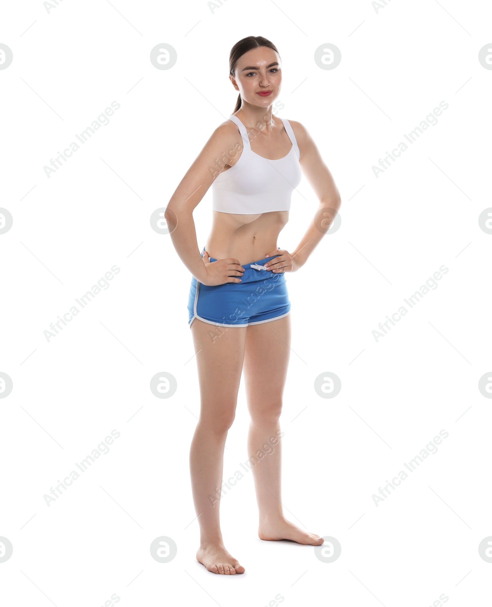 Woman doing abdominal vacuum exercise on white background Photo of Woman doing abdominal vacuum exercise on white background