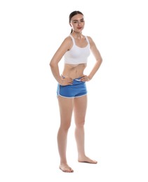 Photo of Woman doing abdominal vacuum exercise on white background