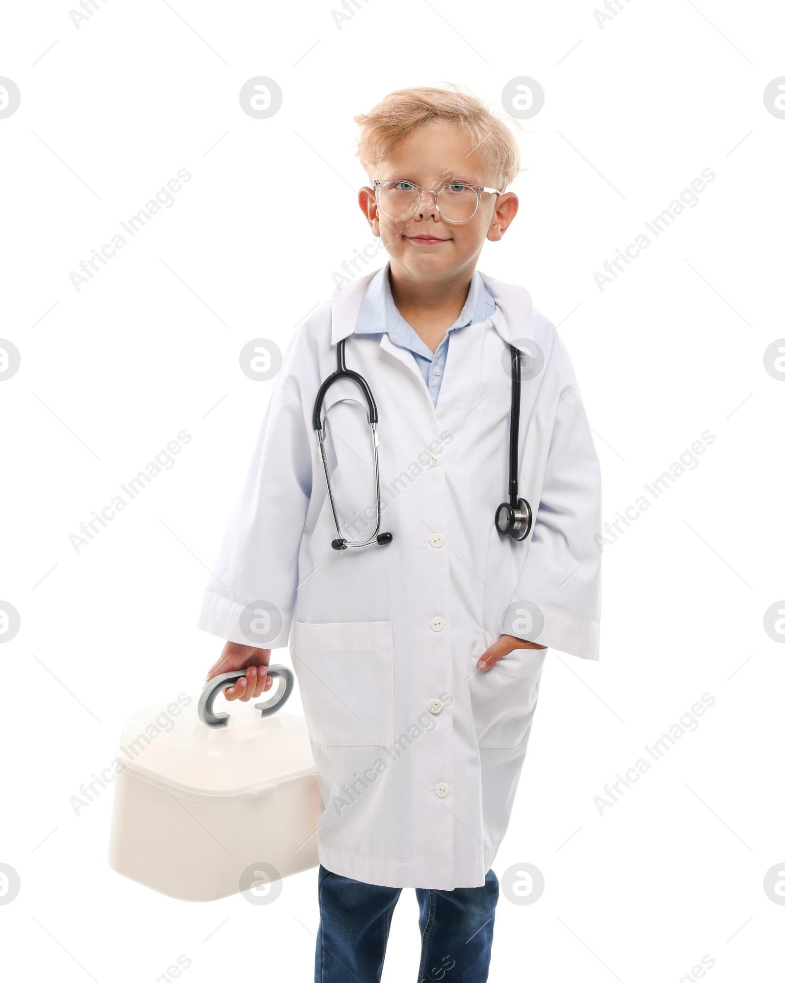 Photo of Choice of profession. Little boy with stethoscope and case pretending to be doctor on white background