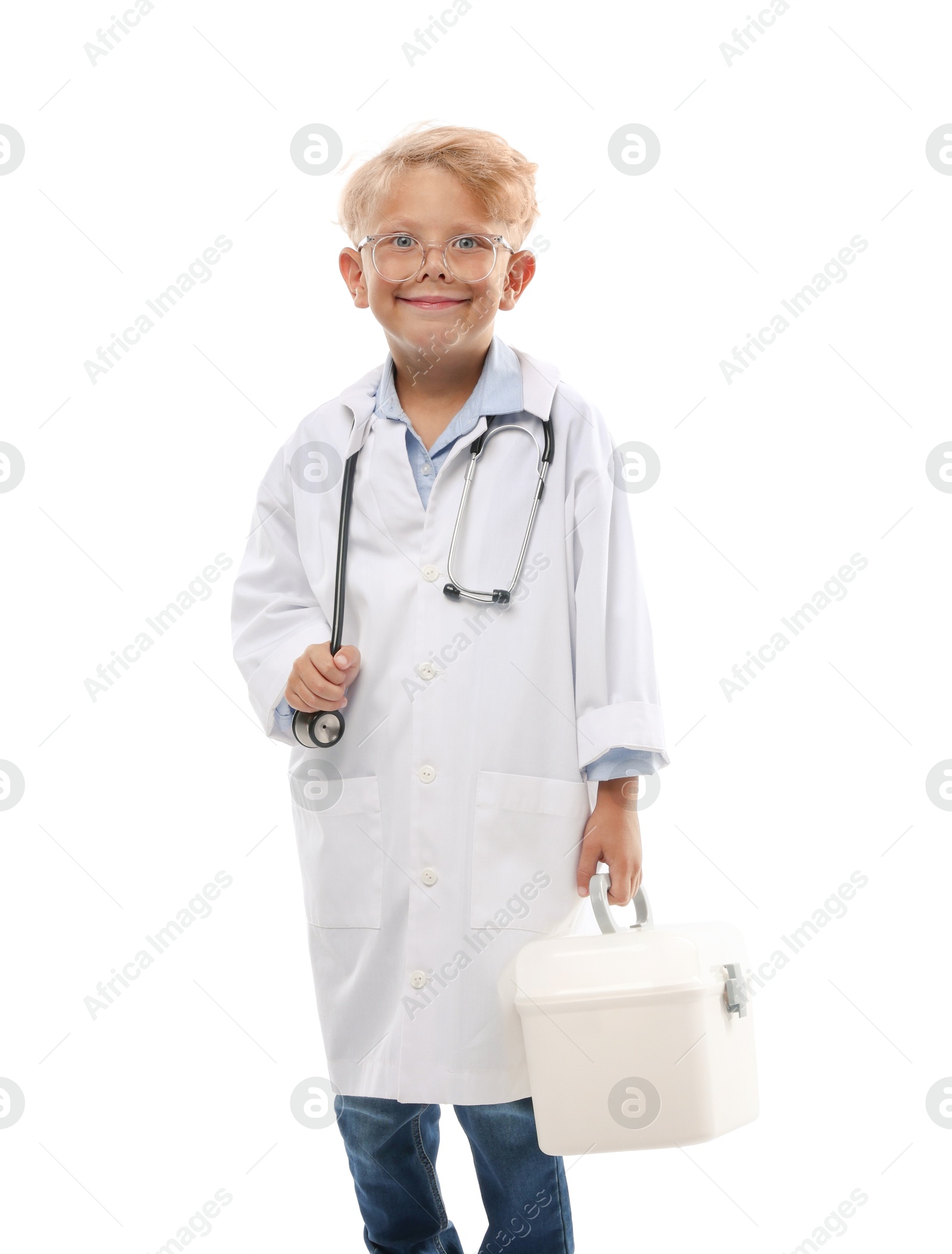 Photo of Choice of profession. Little boy with stethoscope and case pretending to be doctor on white background