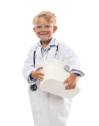 Photo of Choice of profession. Little boy with stethoscope and case pretending to be doctor on white background