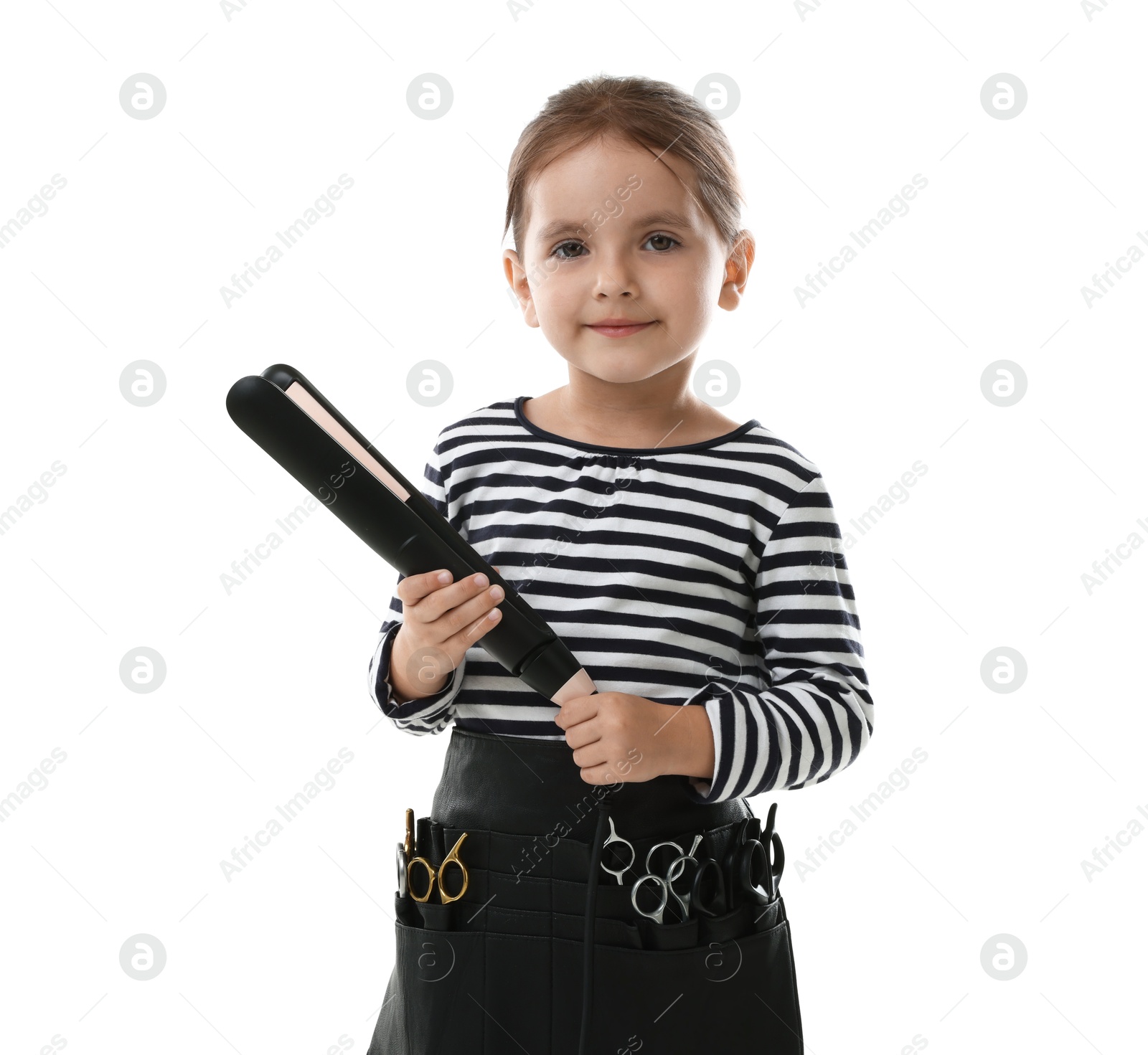 Photo of Choice of profession. Cute little girl with straightener and tools pretending to be hairdresser on white background