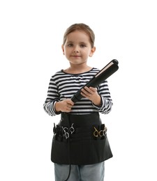 Photo of Choice of profession. Cute little girl with straightener and tools pretending to be hairdresser on white background