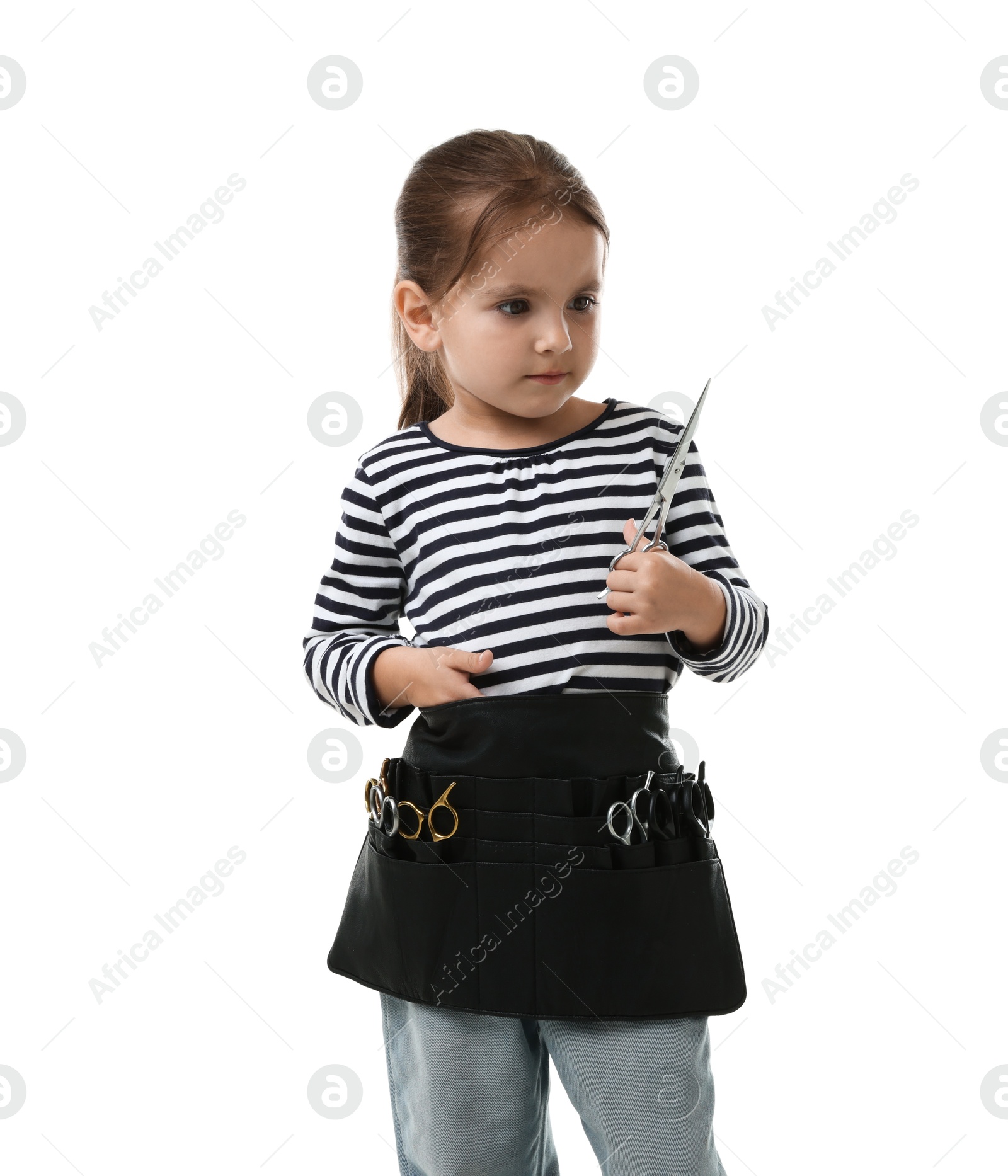 Photo of Choice of profession. Cute little girl with tools pretending to be hairdresser on white background