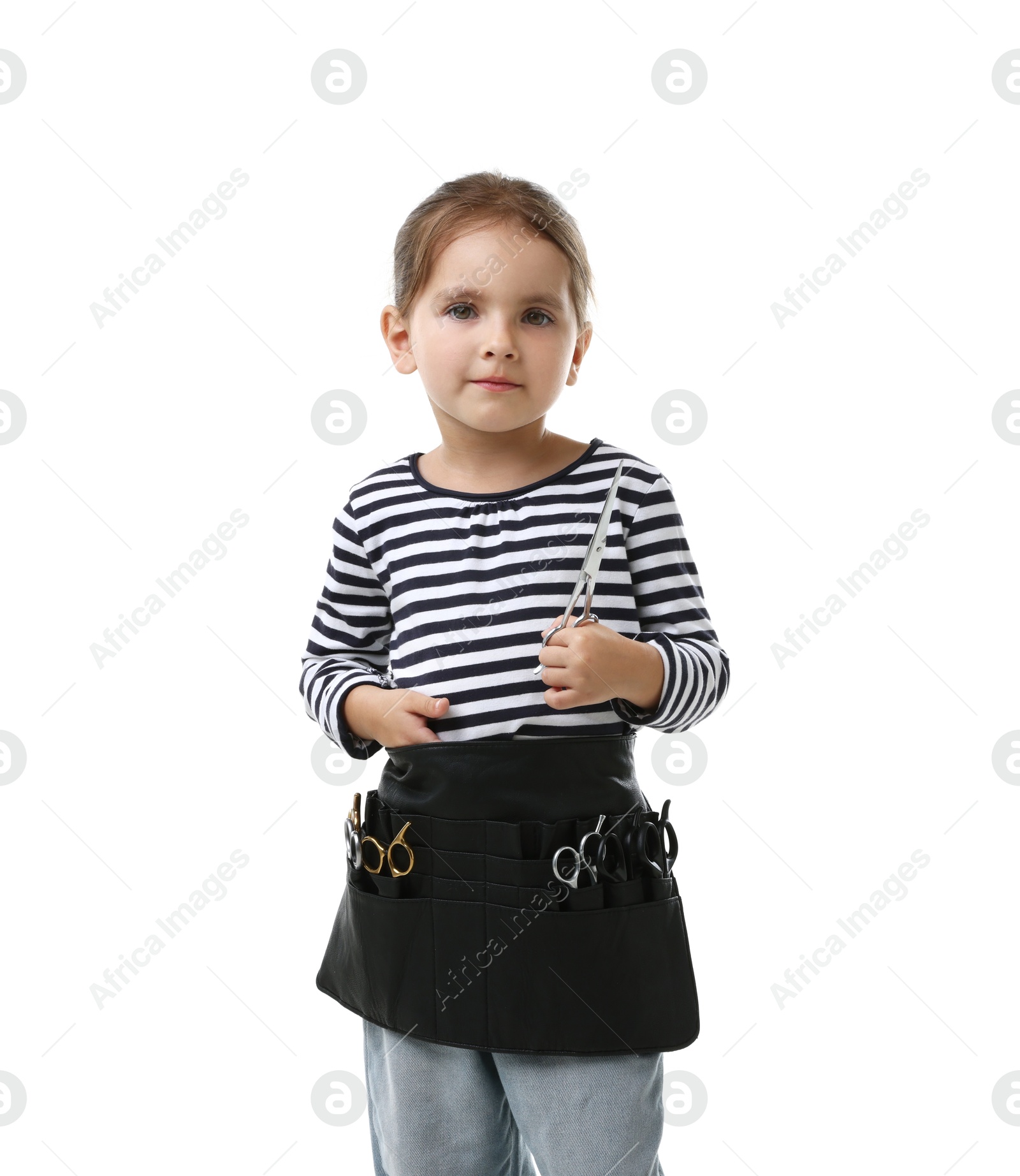 Photo of Choice of profession. Cute little girl with tools pretending to be hairdresser on white background
