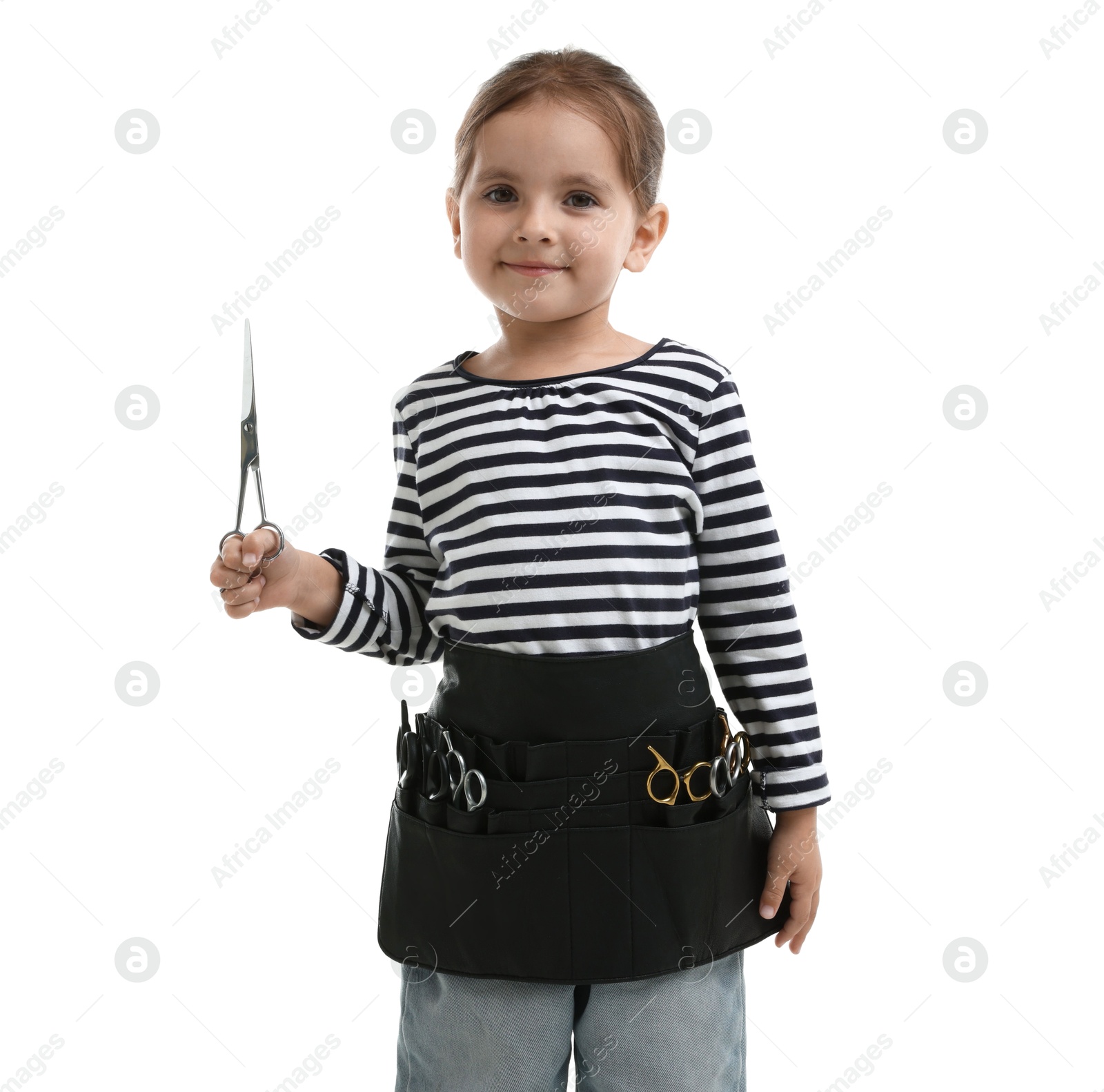 Photo of Choice of profession. Cute little girl with tools pretending to be hairdresser on white background