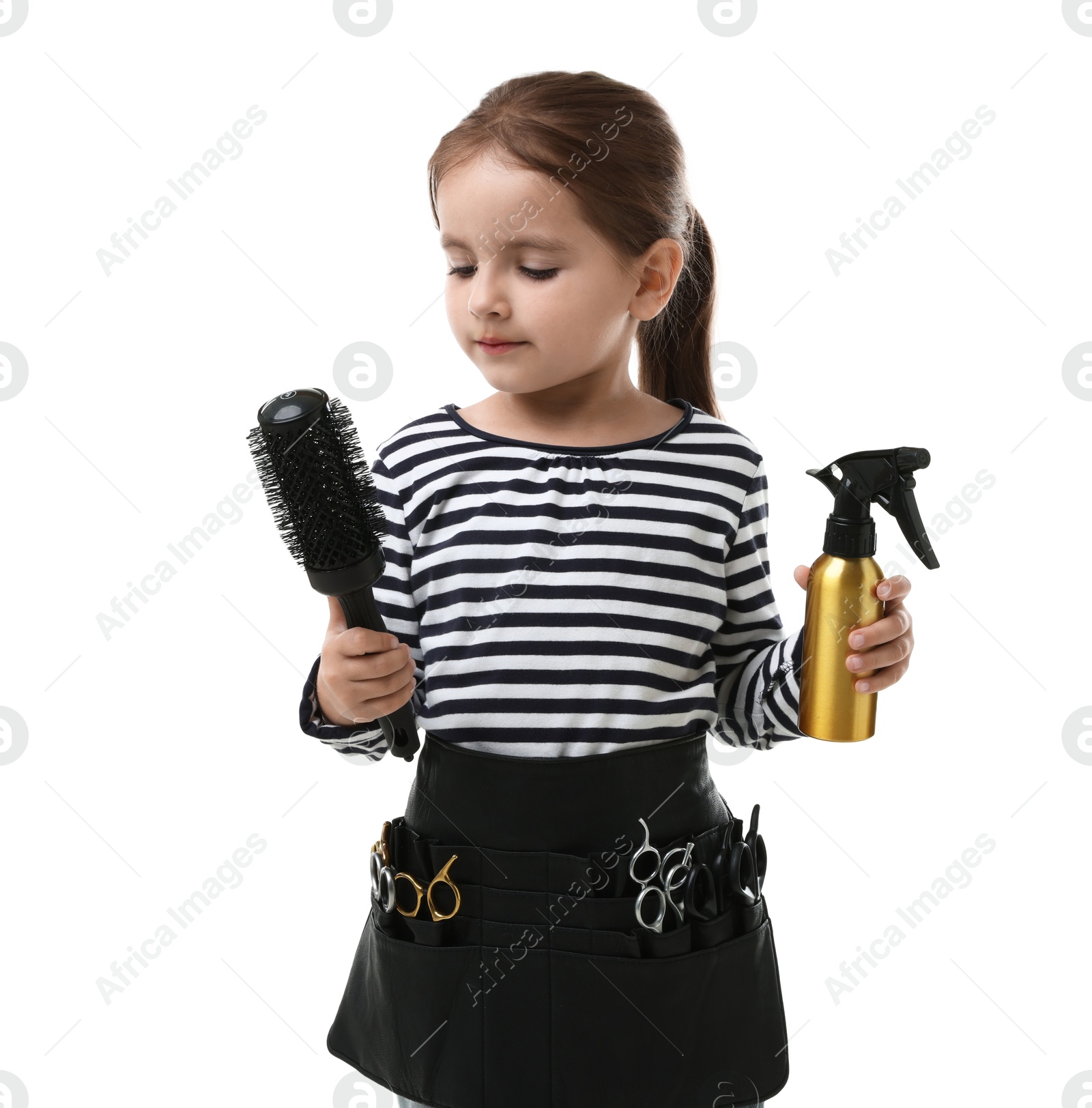 Photo of Choice of profession. Cute little girl with tools pretending to be hairdresser on white background