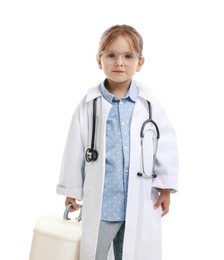 Photo of Choice of profession. Little girl in uniform with stethoscope and case pretending to be doctor on white background