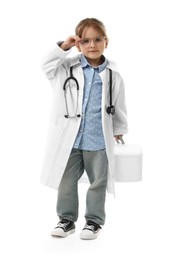 Photo of Choice of profession. Little girl in uniform with stethoscope and case pretending to be doctor on white background