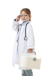 Photo of Choice of profession. Little girl in uniform with stethoscope and case pretending to be doctor on white background