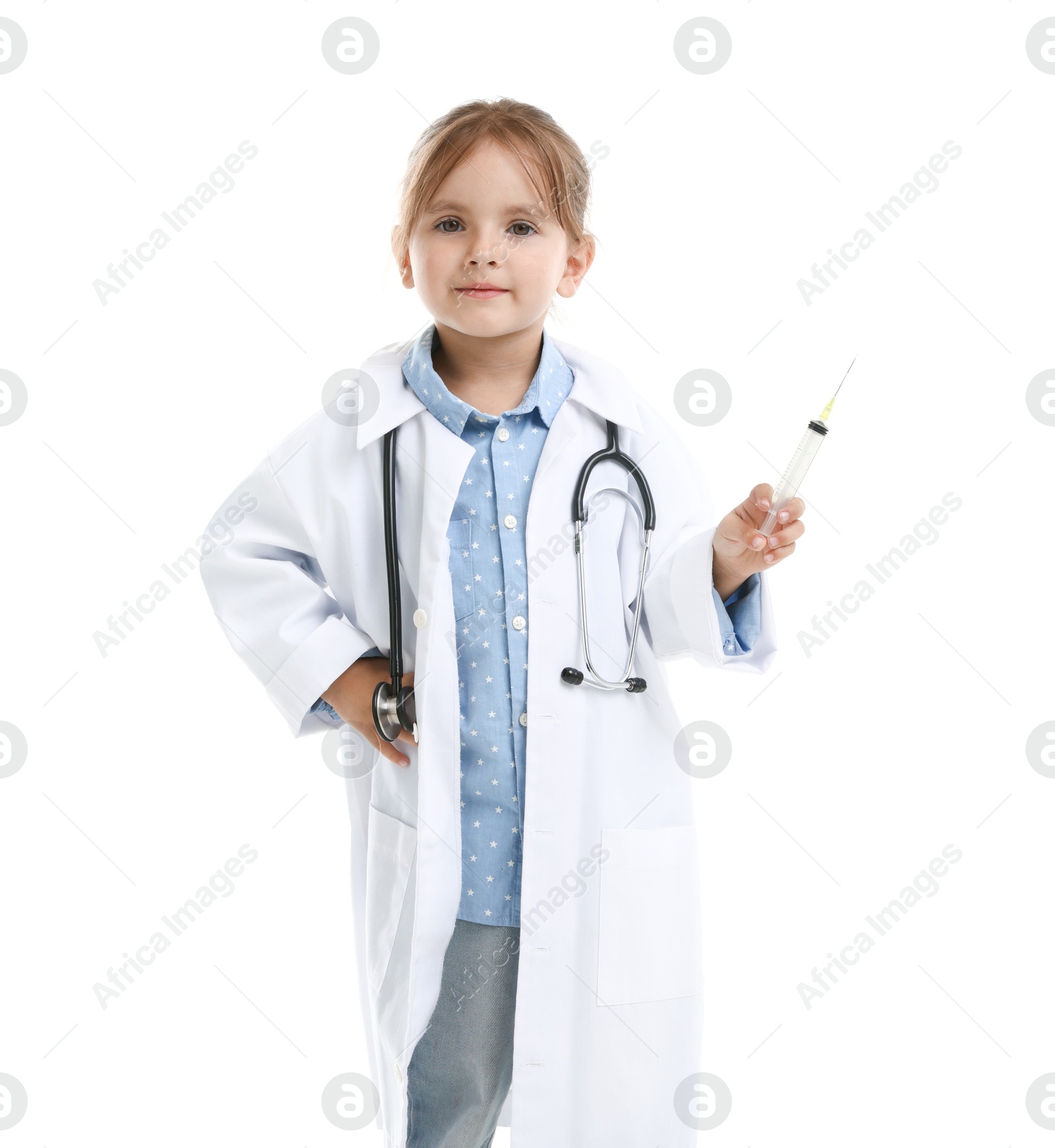 Photo of Choice of profession. Little girl in uniform with stethoscope and syringe pretending to be doctor on white background