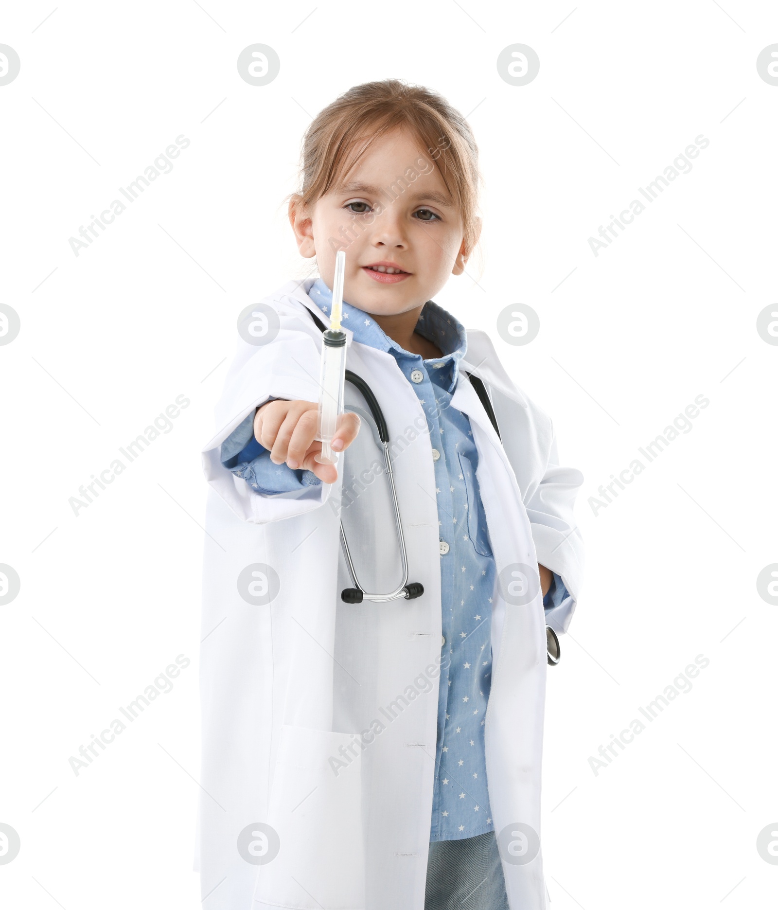 Photo of Choice of profession. Little girl in uniform with stethoscope and syringe pretending to be doctor on white background