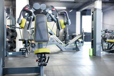 Photo of Professional rear delt machine in gym. Space for text