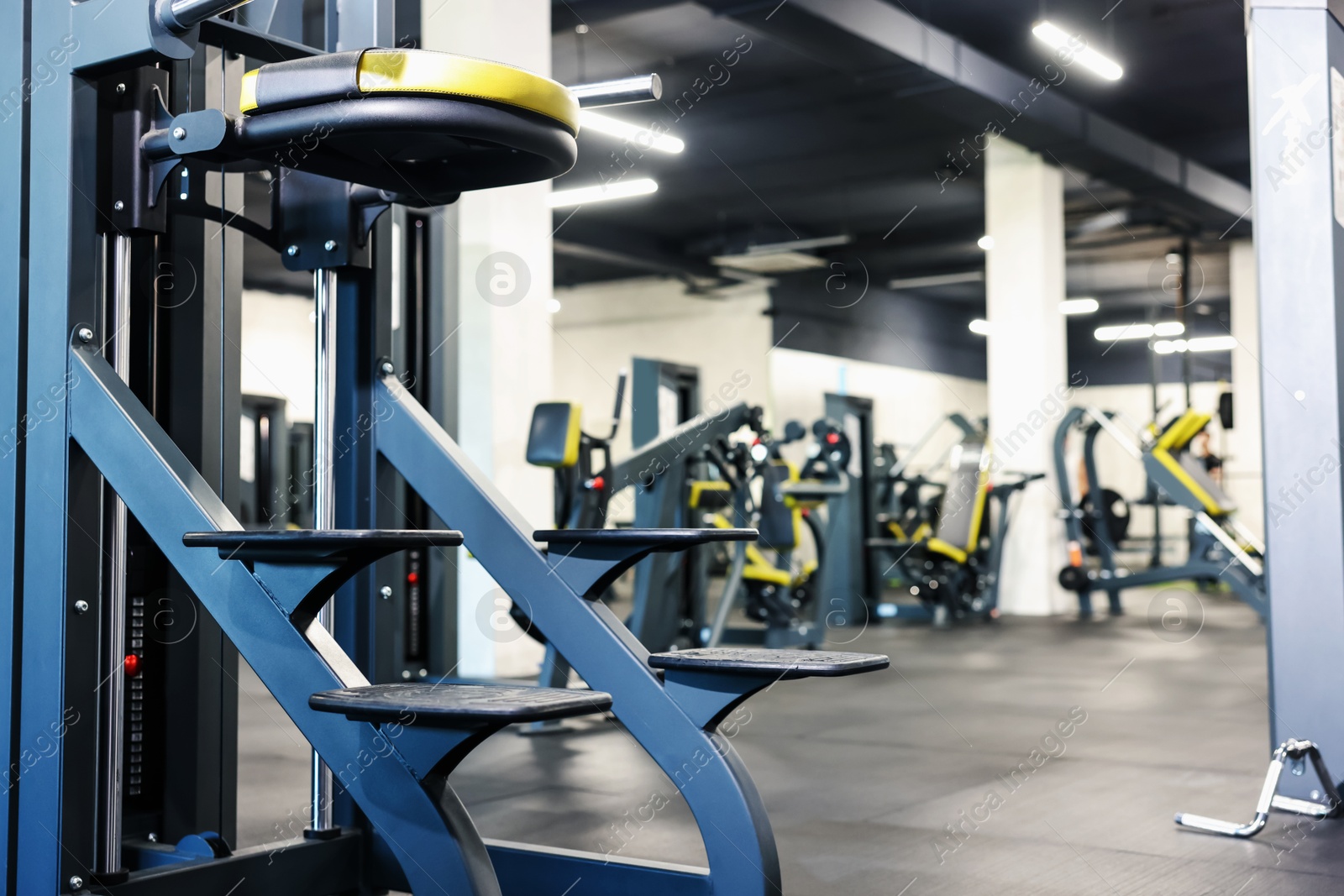 Professional sport equipment in gym. Space for text Photo of Professional sport equipment in gym. Space for text