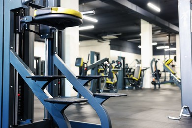 Photo of Professional sport equipment in gym. Space for text