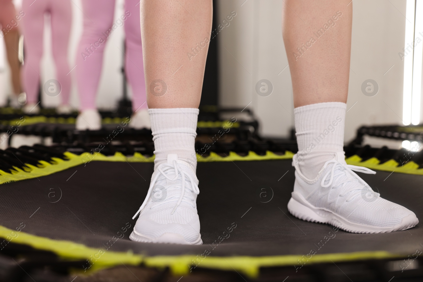 Women training on mini exercise trampolines in fitness studio, closeup Photo of Women training on mini exercise trampolines in fitness studio, closeup