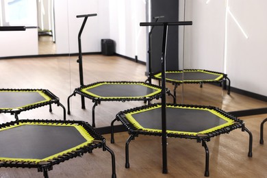 Photo of Mini exercise trampolines near mirror in fitness studio