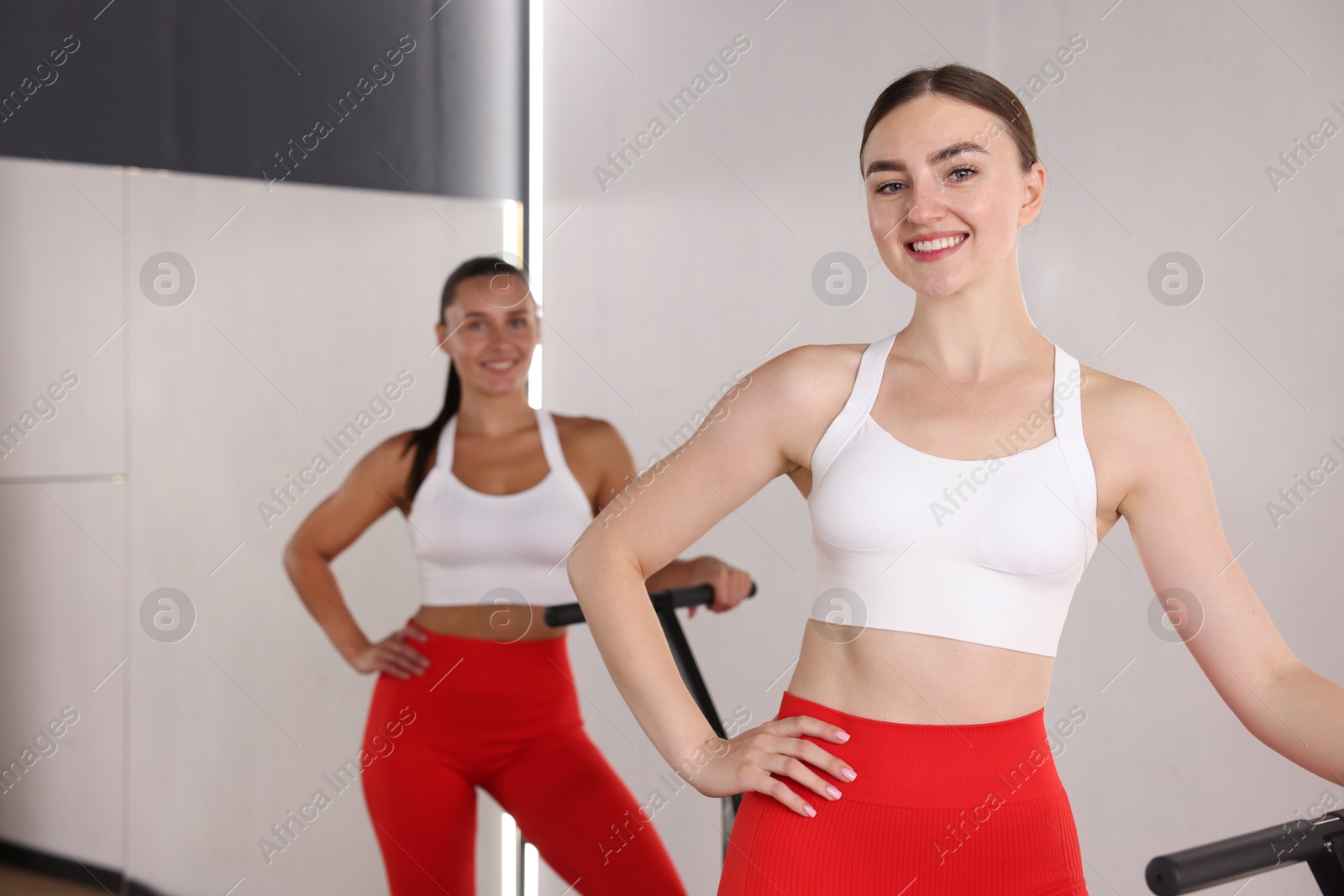 Smiling women on mini exercise trampolines in fitness studio Photo of Smiling women on mini exercise trampolines in fitness studio