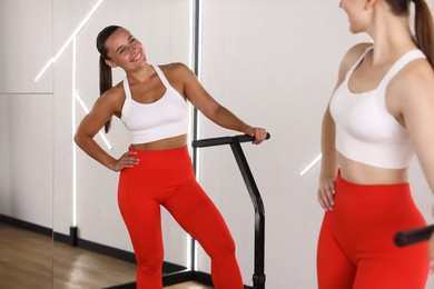 Photo of Young women on mini exercise trampolines in fitness studio
