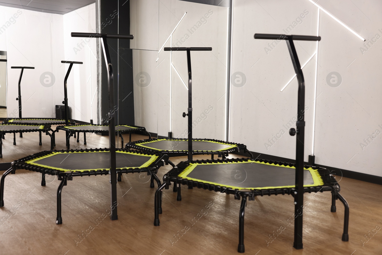 Mini exercise trampolines near mirror in fitness studio Photo of Mini exercise trampolines near mirror in fitness studio