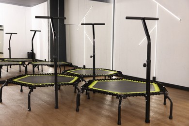 Photo of Mini exercise trampolines near mirror in fitness studio