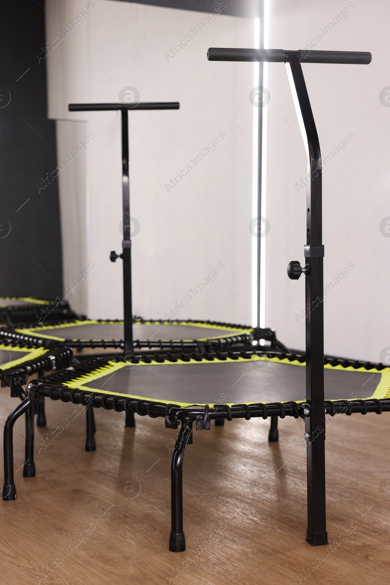 Mini exercise trampolines near mirror in fitness studio Photo of Mini exercise trampolines near mirror in fitness studio