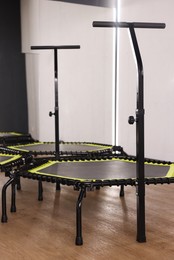 Photo of Mini exercise trampolines near mirror in fitness studio