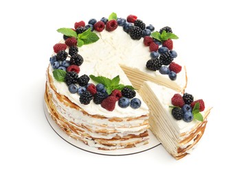 Photo of Tasty crepe cake with berries and mint isolated on white