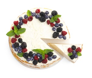 Photo of Tasty crepe cake with berries and mint isolated on white, top view