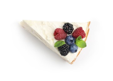 Photo of Piece of tasty crepe cake with berries and mint isolated on white, top view
