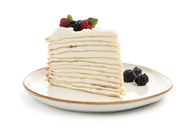 Photo of Piece of tasty crepe cake with berries and mint isolated on white